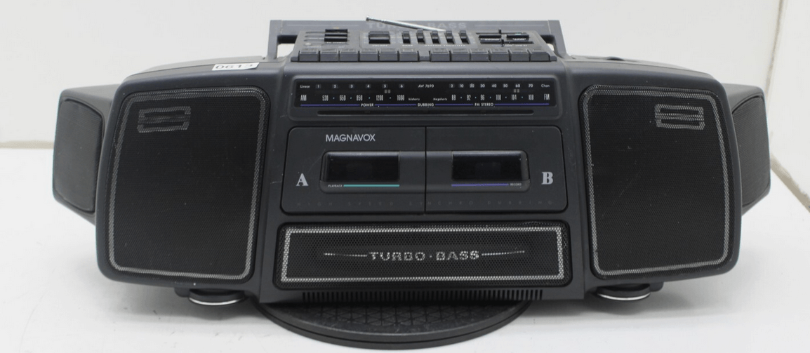 A vintage Magnavox boombox with two speakers, dual cassette decks, and a TURBO BASS logo