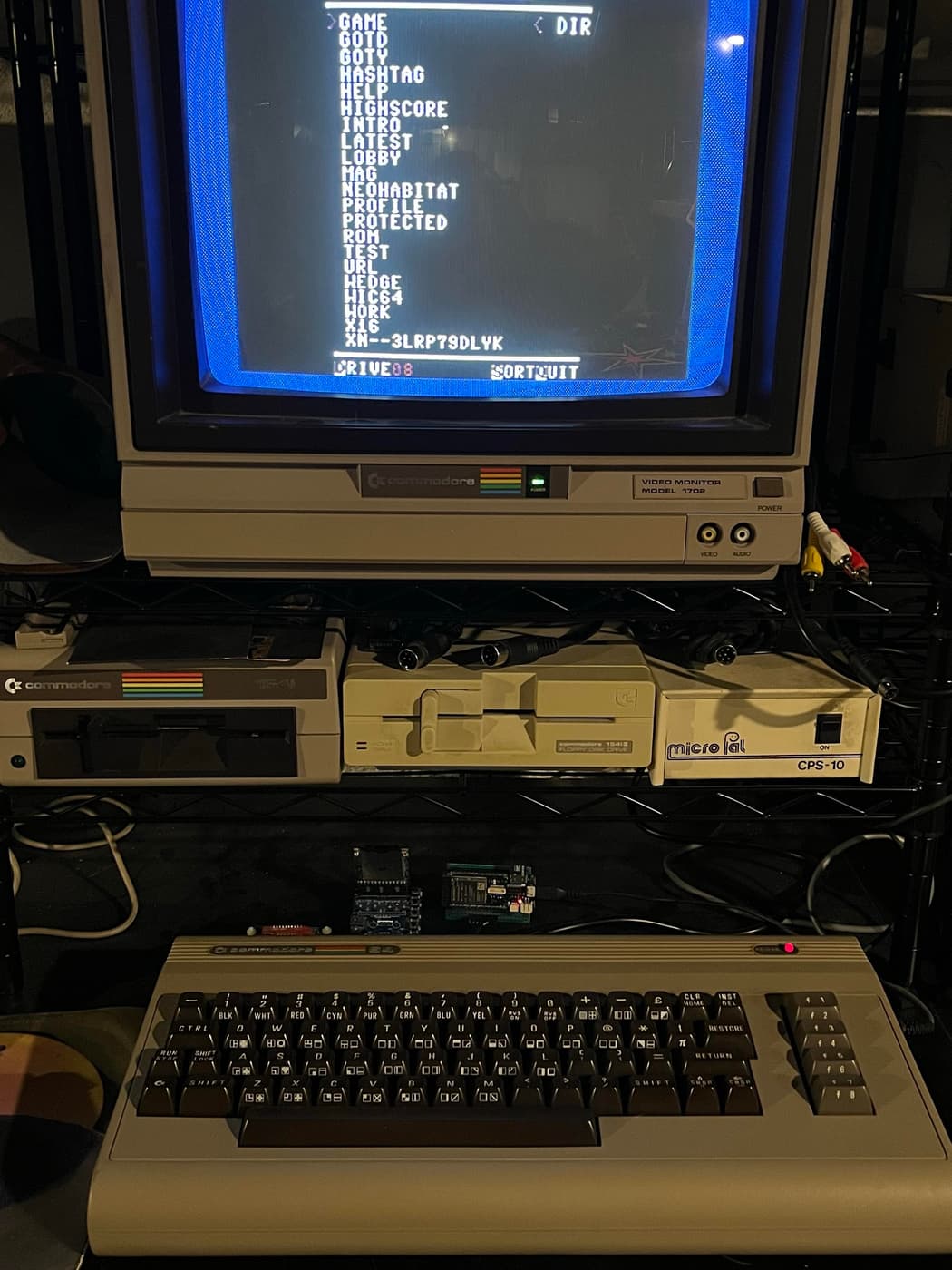 Commodore 64 with monitor showing directory